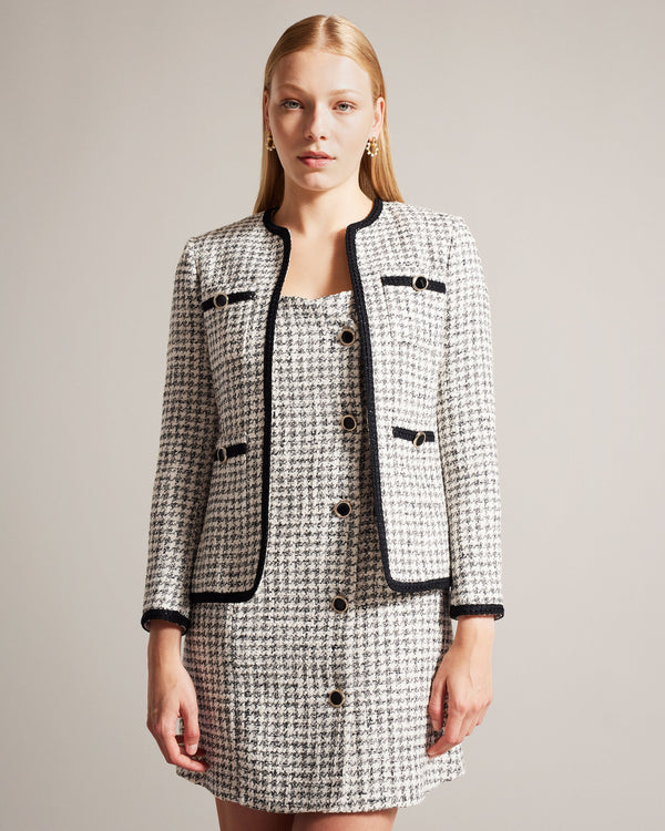LYRRA-Jackets-Check into the week in style. Featuring a classic dogtooth pattern and contrast trims, LYRRA adds a touch of understated elegance to any outfit. Front pockets and decorative buttons complete the look, with an open front design for easy layering. Boucle jacket Dogtooth pattern Contrast trims Front pockets Decorative buttons Open front- Ted Baker Romania